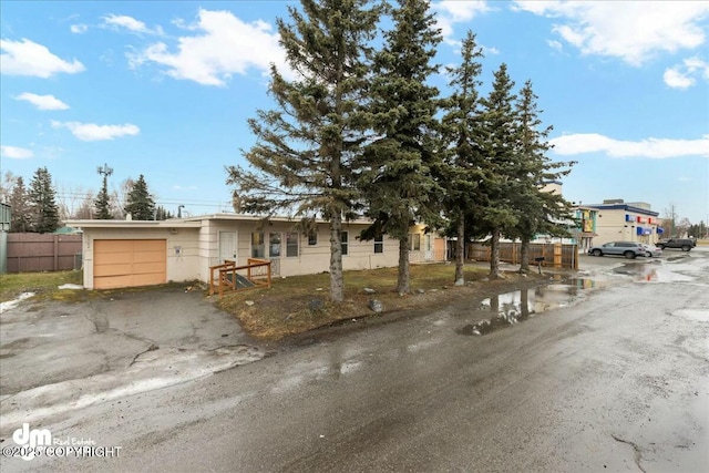 view of front of property featuring a garage