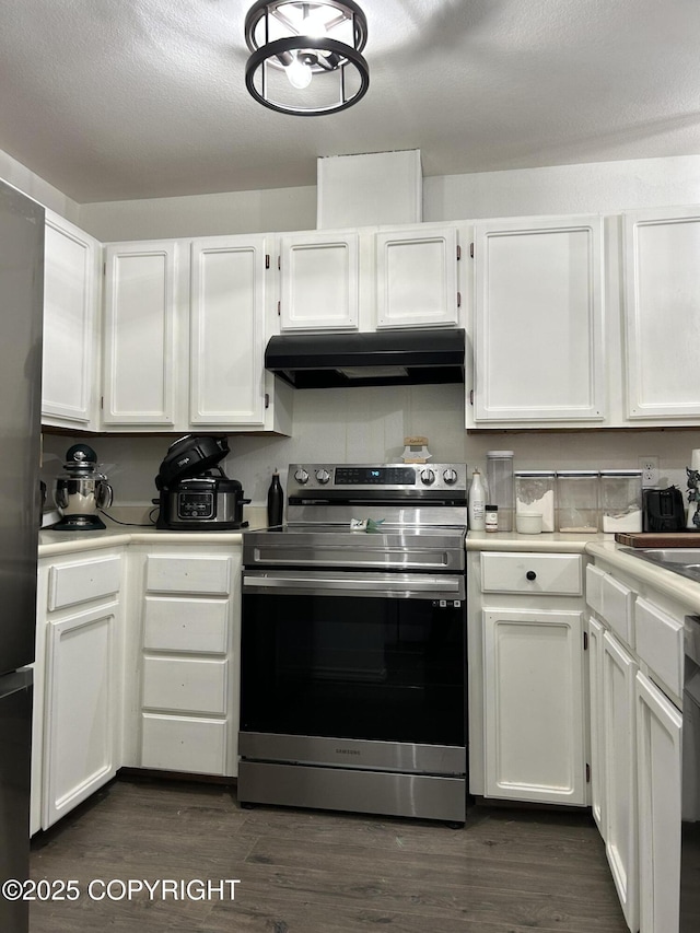 kitchen featuring dark wood-type flooring, white cabinetry, and stainless steel appliances