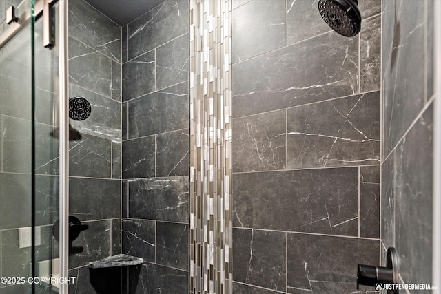 bathroom with tiled shower