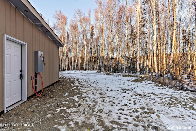 view of yard layered in snow