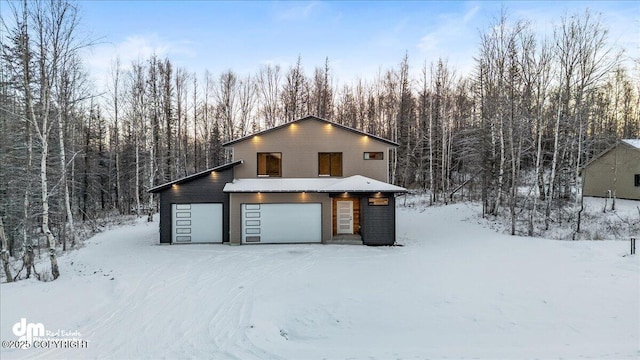 view of snow covered garage