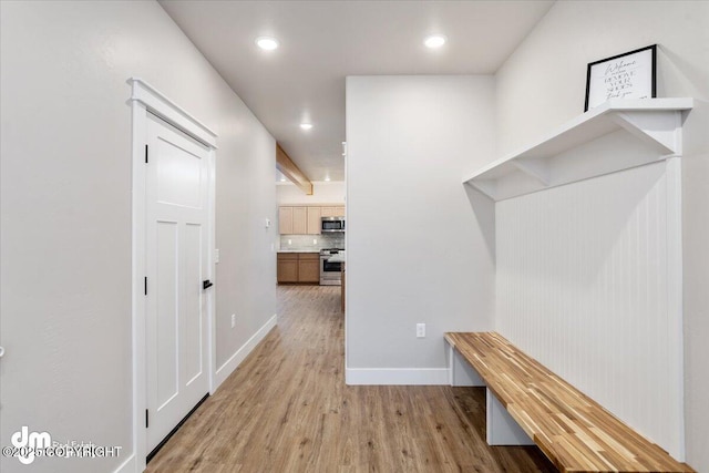 hall with light wood-type flooring