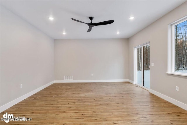 unfurnished room featuring light hardwood / wood-style flooring and ceiling fan