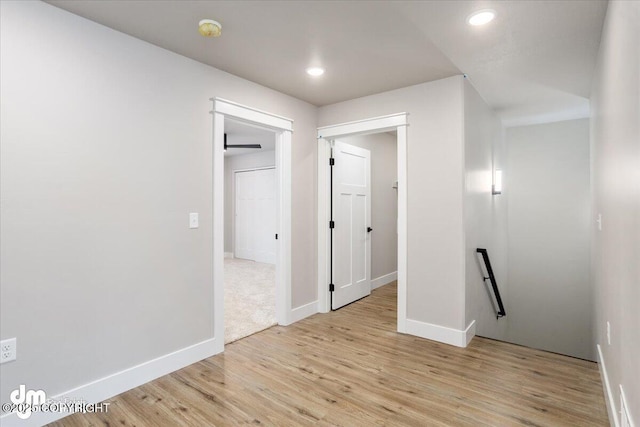 hall with light hardwood / wood-style flooring