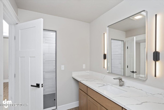 bathroom with vanity and hardwood / wood-style floors