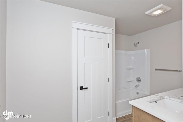 bathroom with vanity and  shower combination