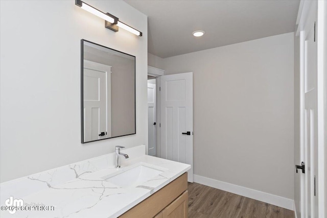 bathroom featuring hardwood / wood-style flooring and vanity