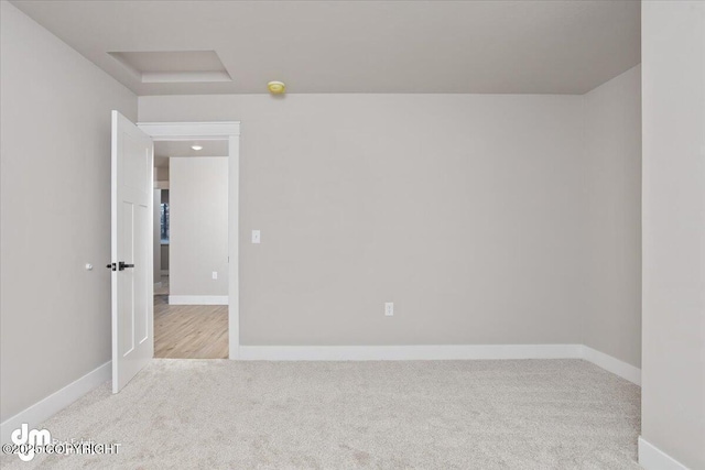 spare room with light colored carpet