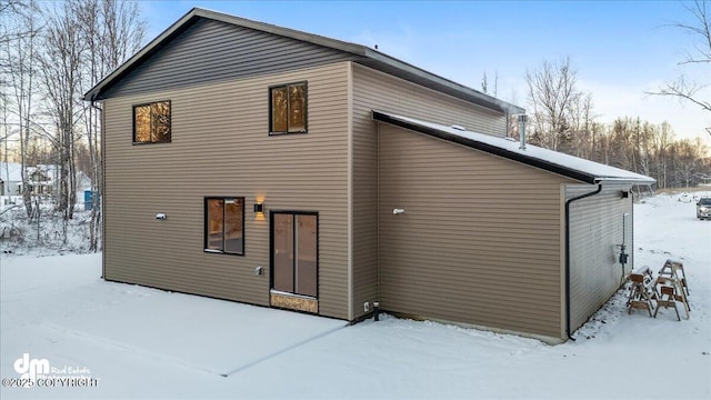 view of snow covered house