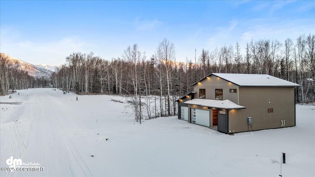 exterior space with a mountain view and a garage