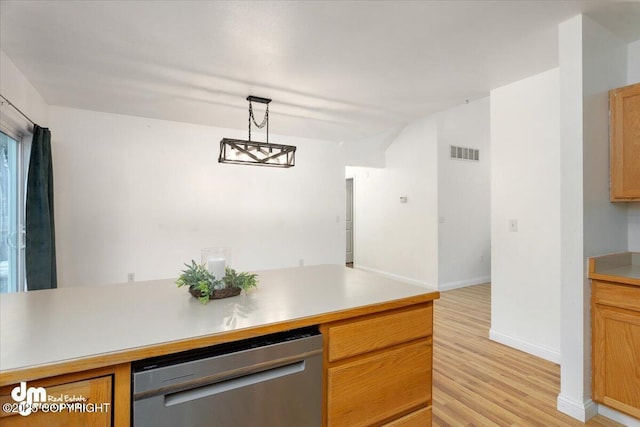 kitchen featuring dishwasher, hanging light fixtures, and light hardwood / wood-style flooring