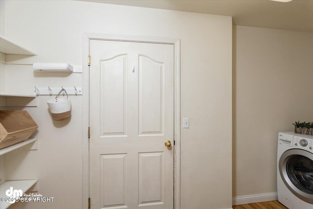 clothes washing area with washer / clothes dryer