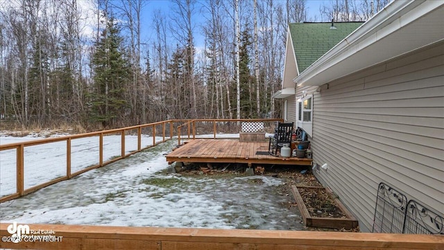 view of snow covered deck