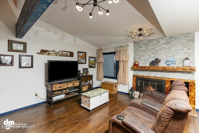 living room featuring dark hardwood / wood-style flooring, a fireplace, lofted ceiling, and a textured ceiling