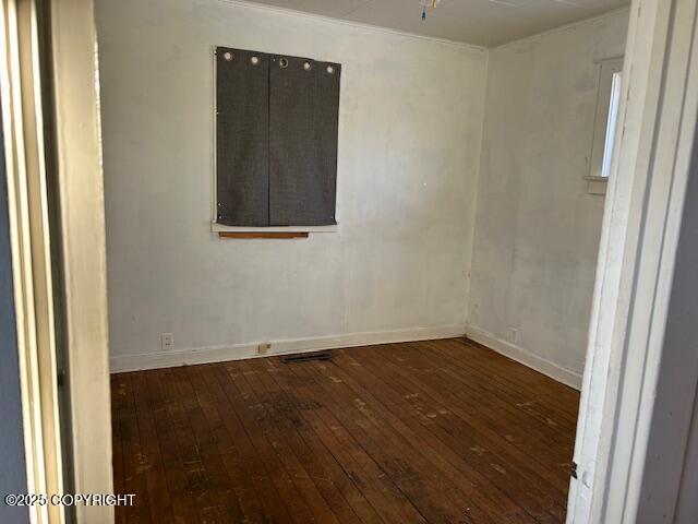 unfurnished room with dark hardwood / wood-style floors