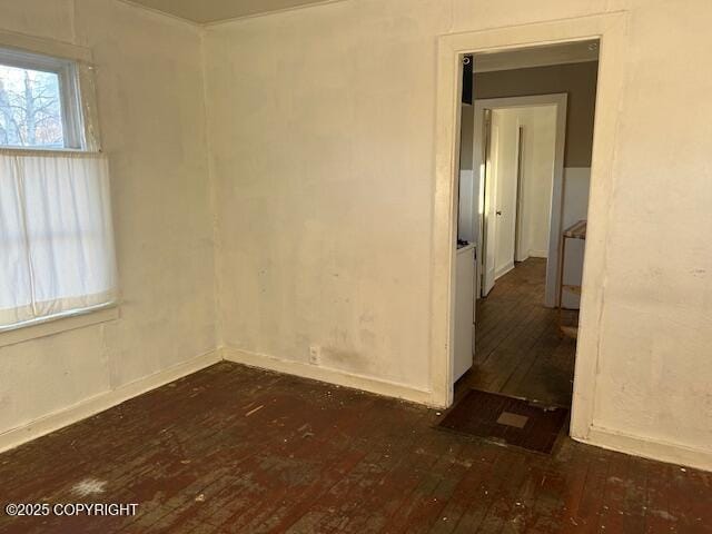 unfurnished room featuring dark hardwood / wood-style floors