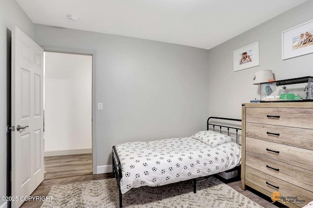 bedroom featuring hardwood / wood-style flooring