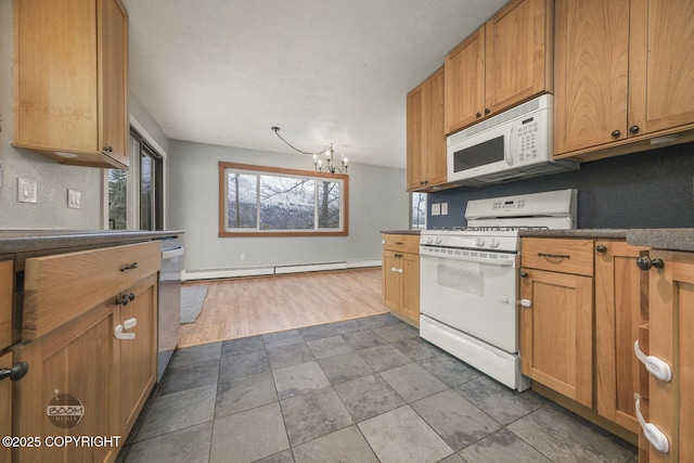 kitchen with a baseboard heating unit, an inviting chandelier, and white appliances