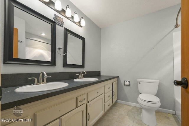 full bathroom with toilet, vanity, tile patterned flooring, and bathtub / shower combination