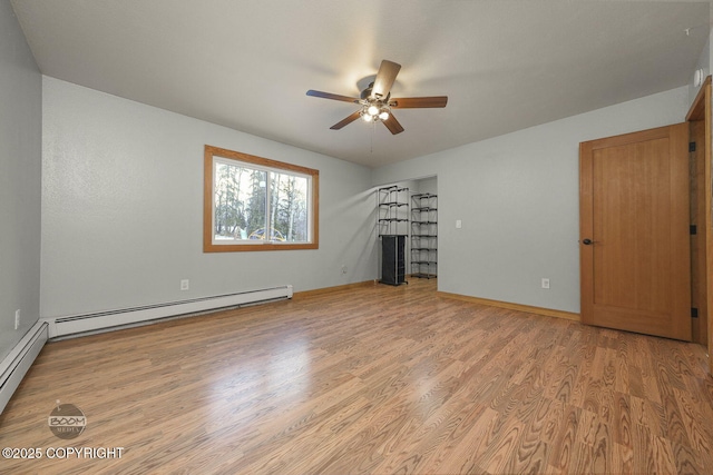 unfurnished living room featuring light wood-type flooring, baseboard heating, and ceiling fan