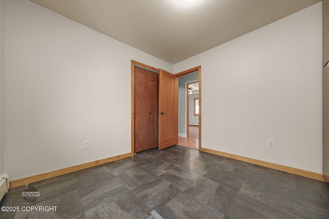 empty room featuring baseboard heating