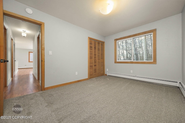 unfurnished bedroom featuring carpet floors, a closet, and a baseboard radiator