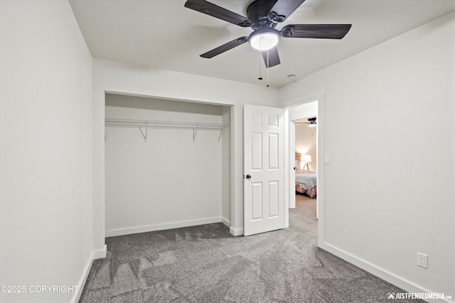 unfurnished bedroom with ceiling fan, a closet, and carpet floors