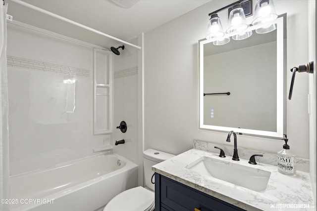 full bathroom featuring washtub / shower combination, toilet, and vanity