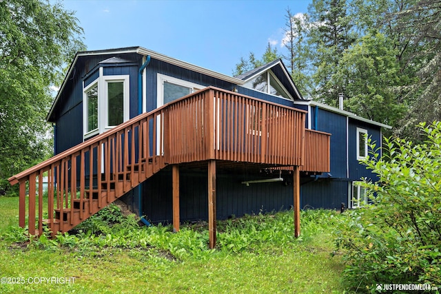 view of side of property featuring a wooden deck