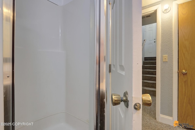 bathroom featuring walk in shower