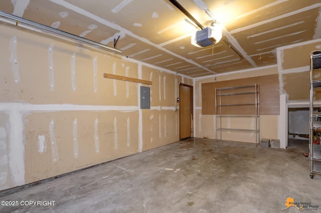 garage featuring a garage door opener and electric panel