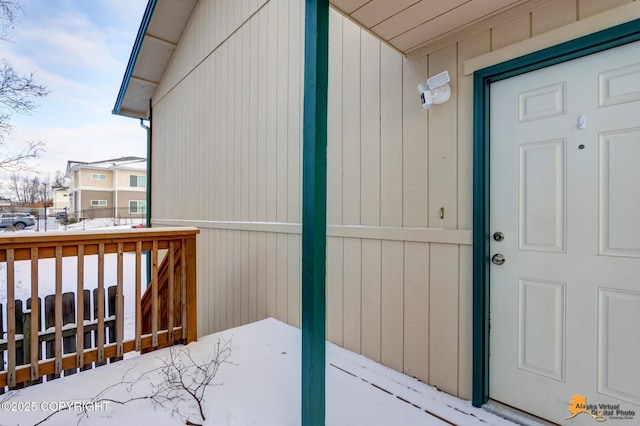 view of snow covered property entrance