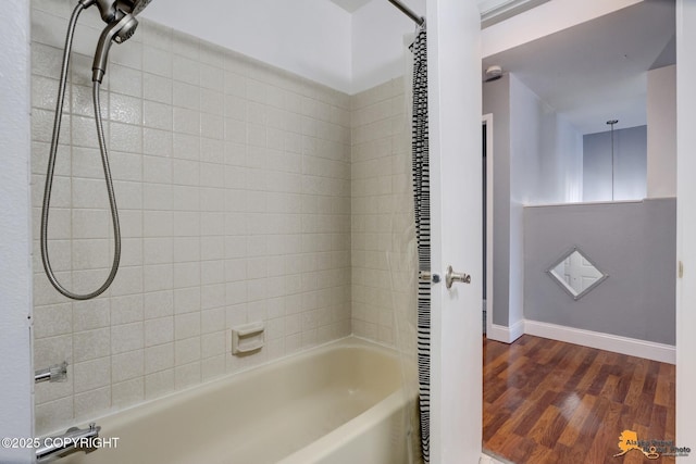 bathroom featuring hardwood / wood-style flooring and shower / bath combo