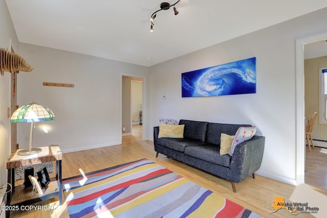 living room with wood finished floors and baseboards