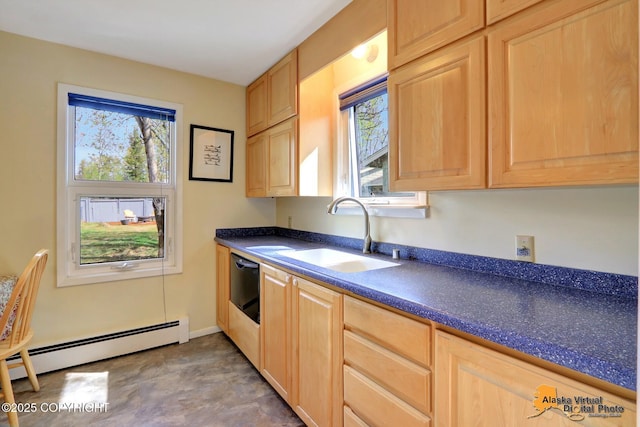 kitchen featuring a baseboard heating unit, a sink, dark countertops, and light brown cabinets