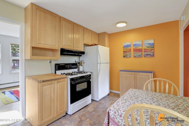 kitchen with range with gas cooktop, under cabinet range hood, light brown cabinetry, light countertops, and freestanding refrigerator