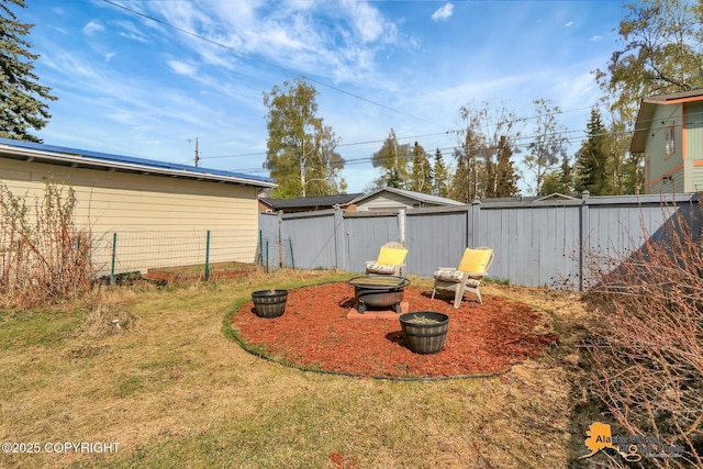 view of yard with an outdoor fire pit