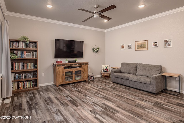 living room featuring ornamental molding, dark hardwood / wood-style floors, and ceiling fan