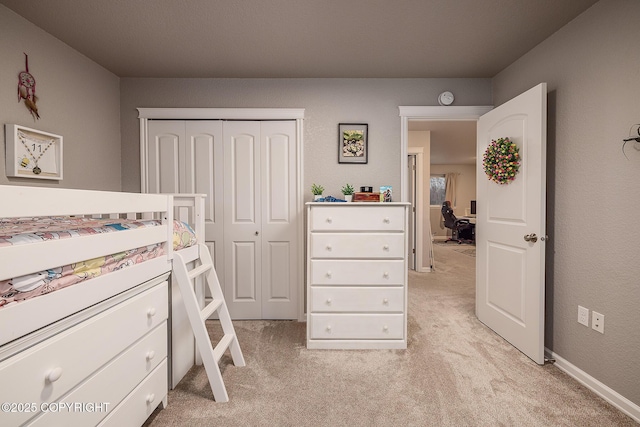 carpeted bedroom with a closet