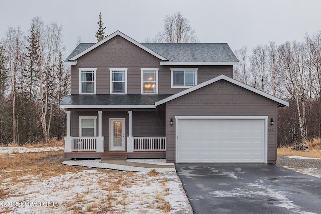 view of front of house featuring a garage and covered porch