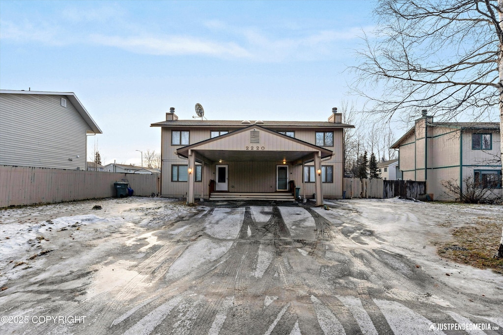 rear view of house with a porch