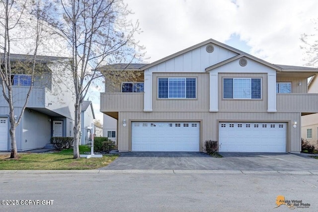 view of front of house featuring aphalt driveway and a garage