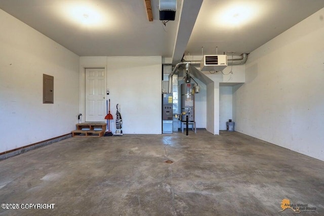 garage with electric panel and water heater