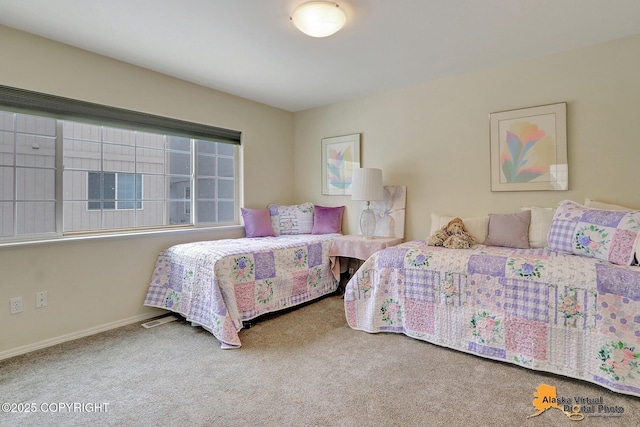 bedroom with visible vents, baseboards, and carpet floors