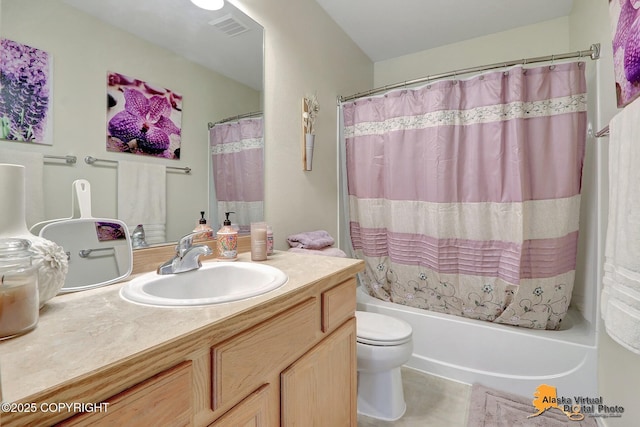 bathroom with visible vents, vanity, shower / tub combo, and toilet