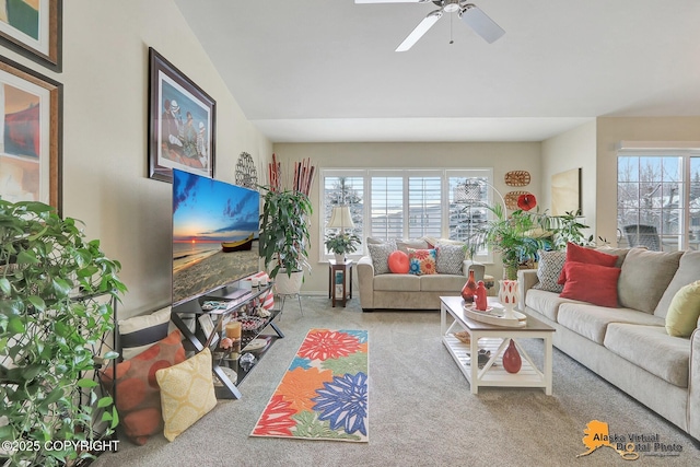 living room with plenty of natural light, ceiling fan, and carpet floors