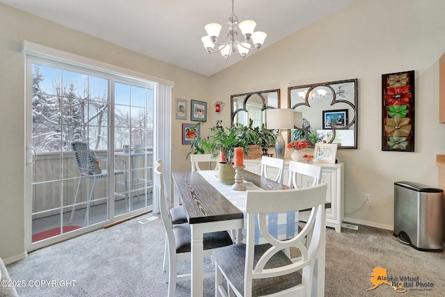 dining room with an inviting chandelier, carpet, baseboards, and vaulted ceiling