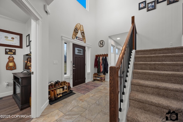 foyer entrance with a high ceiling