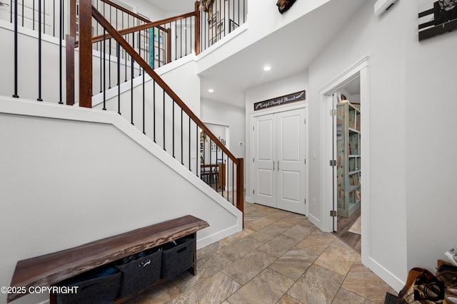 entryway with a high ceiling