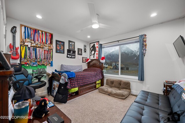 bedroom featuring ceiling fan and carpet floors